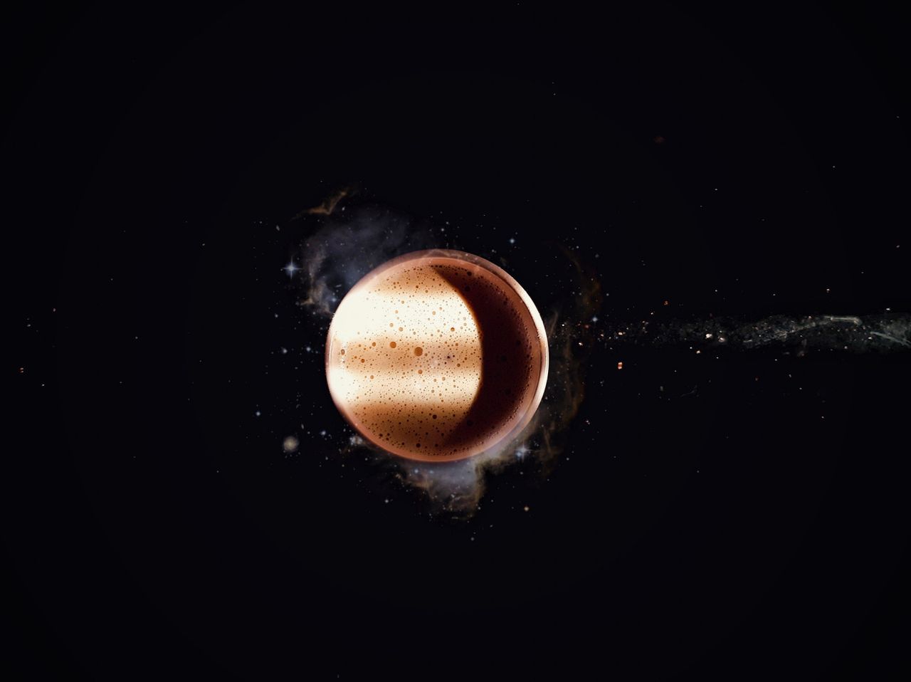 Crafting Captivating Headlines: Your awesome post title goes here A macro shot of a coffee cup resembling a planet in space, under sunlight and shadow.